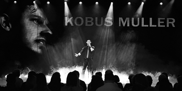 Photo of Kobus Muller, singer, songwriter, and music producer, during a performance on AIDA cruises.